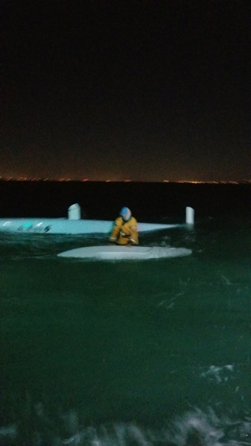 A Coast Guard 29-foot Response Boat-Small II boatcrew from Station Fort Myers Beach rescues Fort Walton Beach native, Randy Smyth, from his capsized 20-foot trimaran sailboat 12 miles south of Sanibel Island, March 3, 2018. Smyth was participating in the Water Tribe Everglades Challenge, a boat race spanning from St. Petersburg to Key Largo. (U.S. Coast Guard photo.)